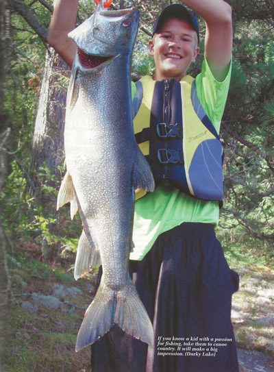Charlie holding up a fish.